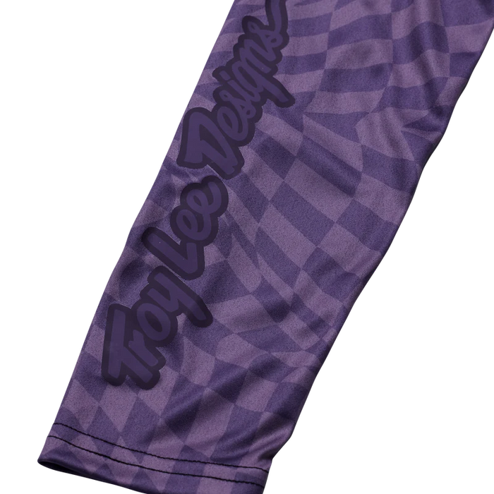 Purple sleeve with checkered pattern and 'Troy Lee Designs' logo on a white background