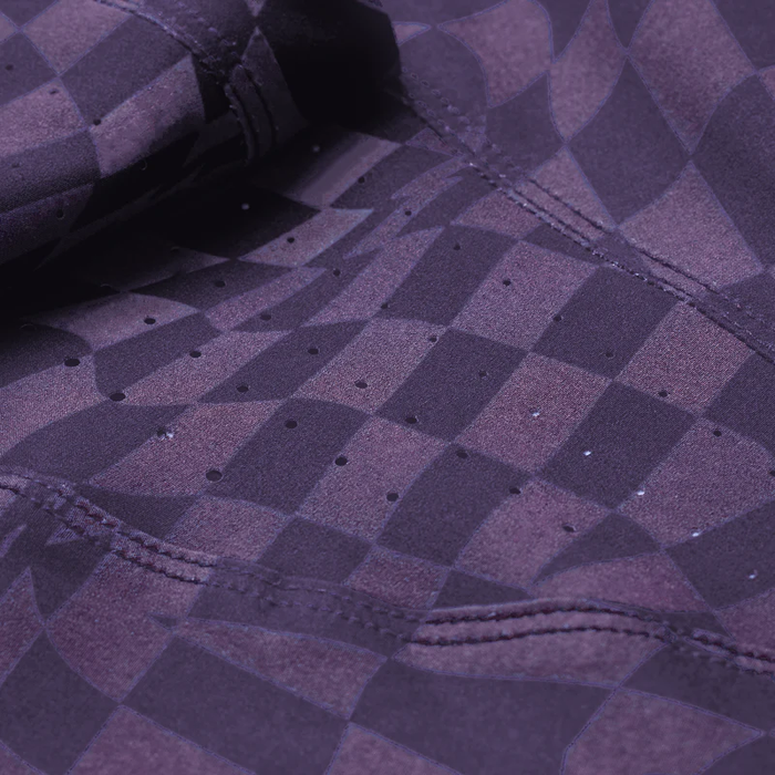 Close-up of purple checkered fabric with a patterned design.