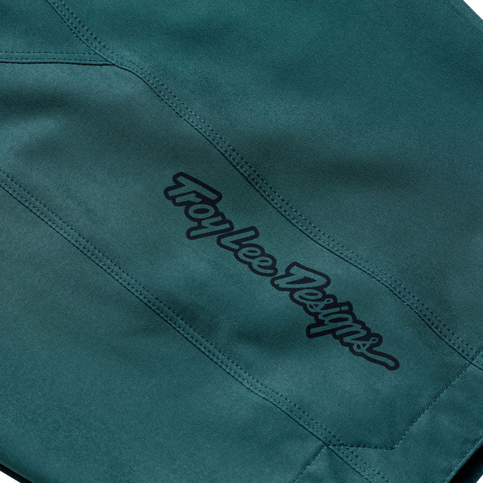 Teal fabric with 'Troy Lee Designs' logo embroidered on it