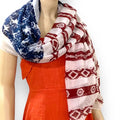 woman wearing a women’s patriotic shawl wrap with usa flag stars and stripes styled as an oversized kimono cover up
