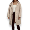 woman wearing open front tan long puffer coat with oversized drawstring hood and snap placket, front view