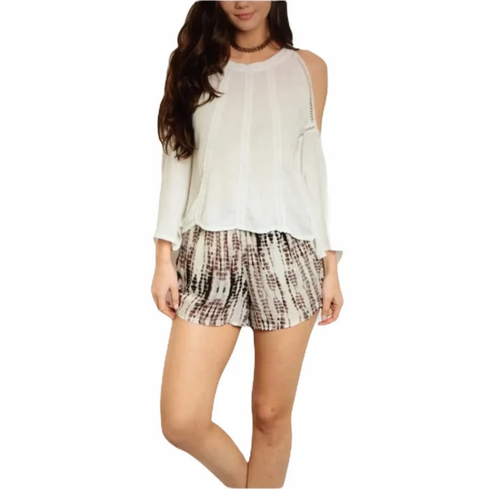 Model wearing Women’s Tie Dye Beige Runner Shorts with elastic waist and side pockets sizes small or medium