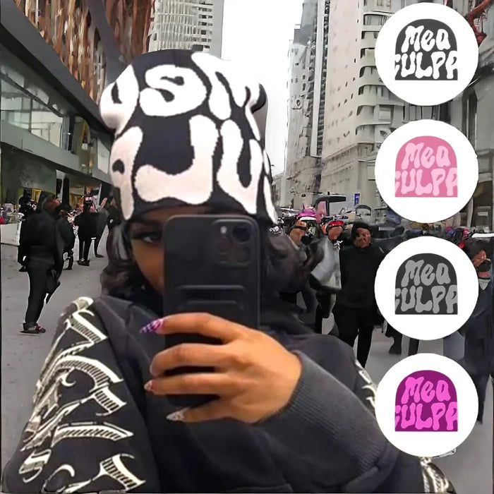 Unisex knit beanie with bold “Mea Culpa” graphic in black and white, styled as winter streetwear hat for Y2K fashion.